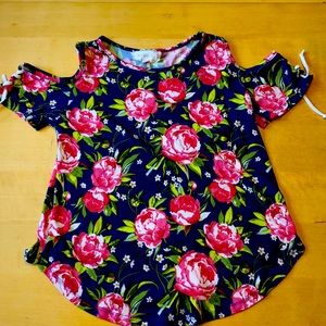 This is a flowery soft, size 10, btween t-shirt.